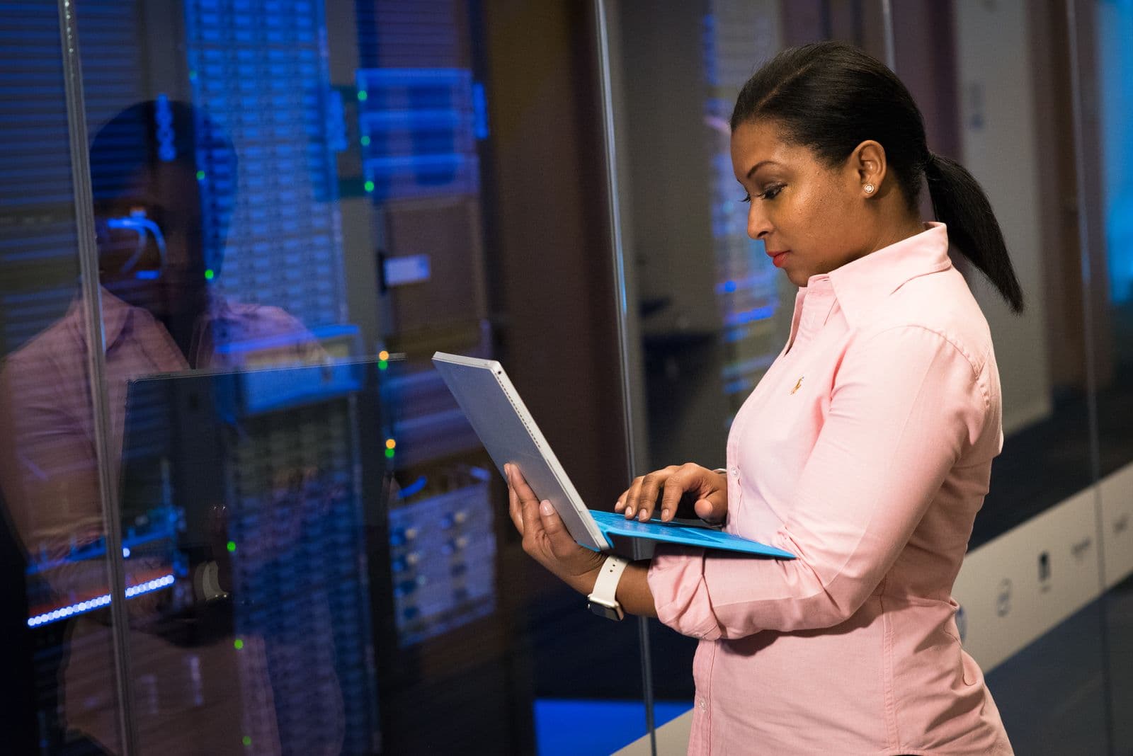 Professional reviewing AI generated business data on a laptop in an office