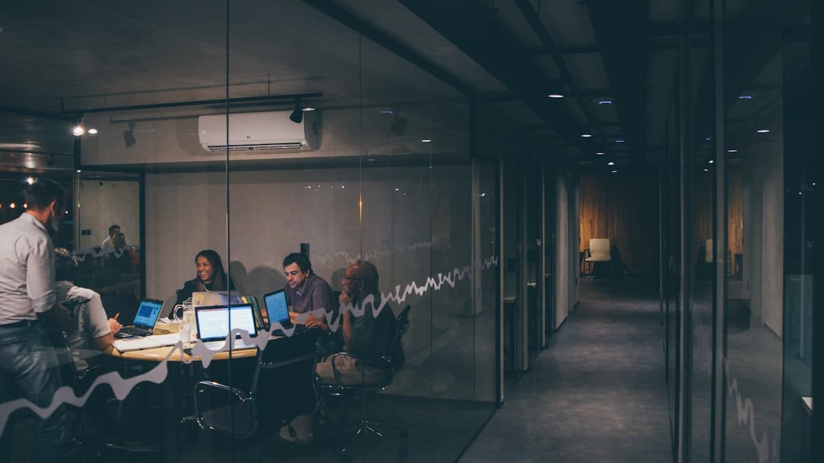 IT team mapping a cloud migration roadmap on a whiteboard