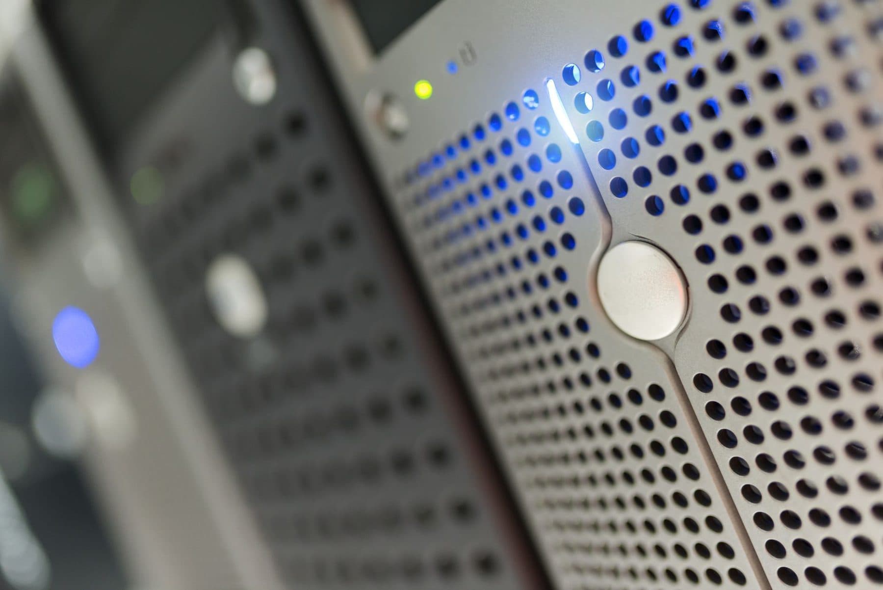Server rack with blue status indicators in a data room